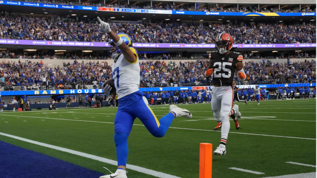 Los Angeles Rams wide receiver Puka Nacua (17) scores on a 70-yard touchdown reception against Cleveland Browns cornerback Kahlef Hailassie (25) in the first half at SoFi Stadium.